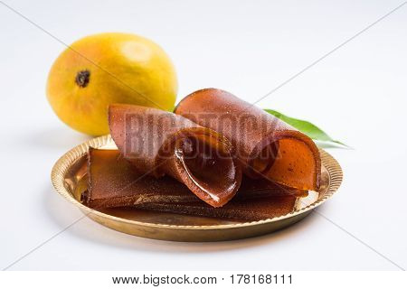 indian alphonso mango's dried jelly called mango papad or mango poli or slab or cake, traditional maharashtrian recipe