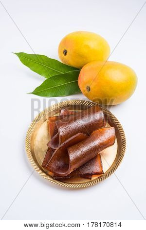 indian alphonso mango's dried jelly called mango papad or mango poli or slab or cake, traditional maharashtrian recipe