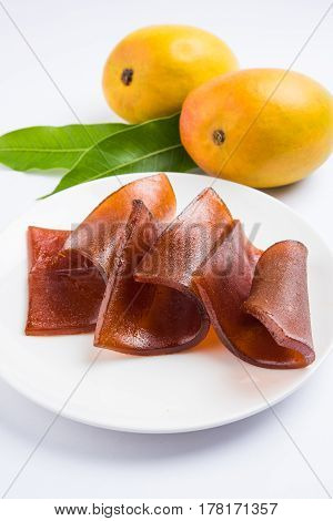 indian alphonso mango's dried jelly called mango papad or mango poli or slab or cake, traditional maharashtrian recipe