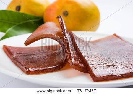 indian alphonso mango's dried jelly called mango papad or mango poli or slab or cake, traditional maharashtrian recipe