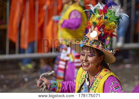 ORURO, BOLIVIA - FEBRUARY 25, 2017: Tinkus dancer in colourful costume performing at the annual Oruro Carnival. The event is designated by UNESCO as being Intangible Cultural Heritage of Humanity.