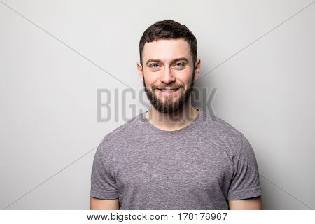 Portrait Of Happy Man On Grey