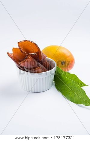 indian alphonso mango's dried jelly called mango papad or mango poli or slab or cake, traditional maharashtrian recipe