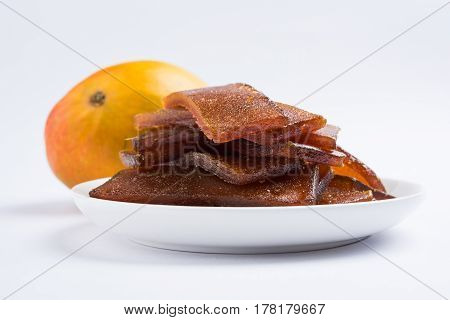 indian alphonso mango's dried jelly called mango papad or mango poli or slab or cake, traditional maharashtrian recipe