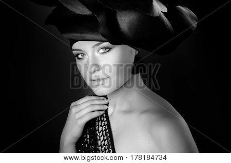 black and white portrait of a girl in a dark roses suit