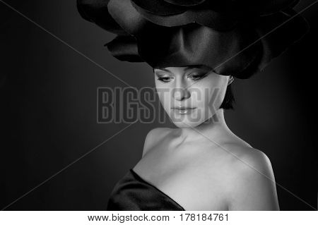 black and white portrait of a girl in a dark roses suit