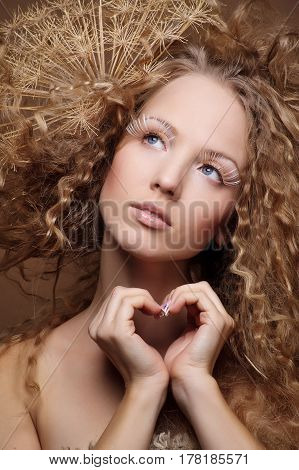 portrait of beautiful curly girl on a beige background