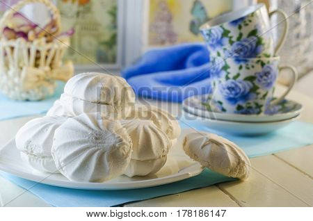 White vanilla marshmallows in a plate on a white background