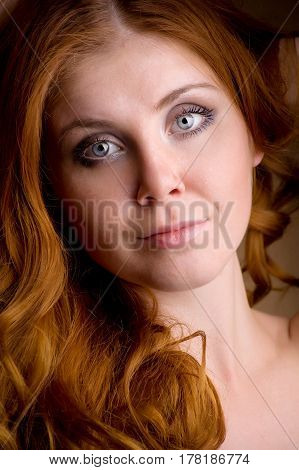 Closeup portrait of a redhead female model