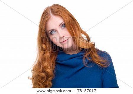 studio portrait of pretty redhead girl on a light background.