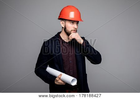 Happy Young Businessman Architect On Grey Background