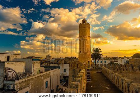 View from the walls of the fortress of Ribat of Sousse in Tunisia. Medieval architecture in sunset light.
