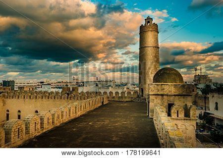 View from the walls of the fortress of Ribat of Sousse in Tunisia. Medieval architecture in sunset light.
