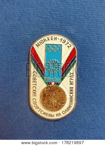 USSR - CIRCA 1977: Badge with the image of the Olympic medal and the inscription 