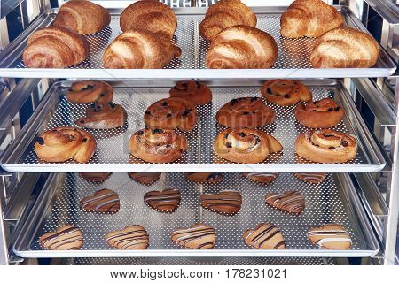 Dessert bread baking in Combi steamer. Production oven at the bakery. Baking bread.