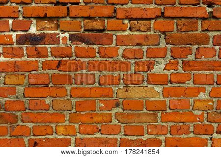 Fragment of the old brick wall of the destroyed building.