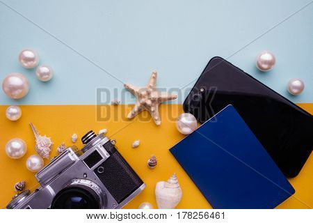 Travel Accessories On Blue And Yellow Background. Essential Vacation Items. Travel Concept, Top View