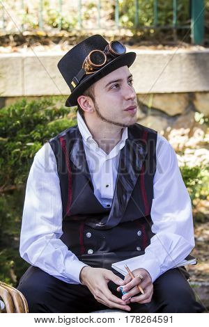CAGLIARI, ITALY - May 29, 2016: Sunday at La Grande Jatte VIII Ed. At the Public Gardens - portrait of a young man in costume steampunk - Sardinia