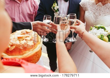 Newlyweds drink champagne with guests on air