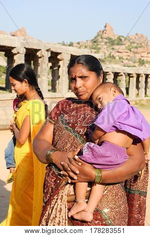 Woman With Her Child In Her Arms