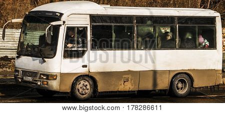 Kazakhstan, Ust-kamenogorsk, march 12, 2017: Minibus rides down the street, bus on the route, shuttle bus