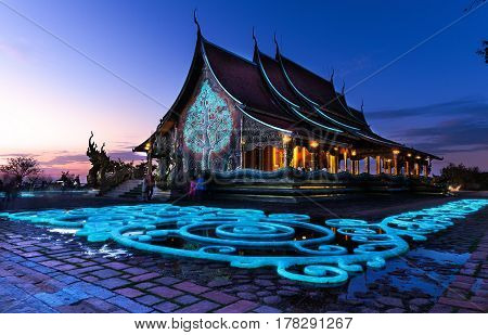 Ubon Ratchathani Thailand - December Wat Sirindhornwararam (Phu Prao Temple) Fluorescent tree and stone in twilight shot on the December 30 2016 in Ubon Ratchathani Thailand