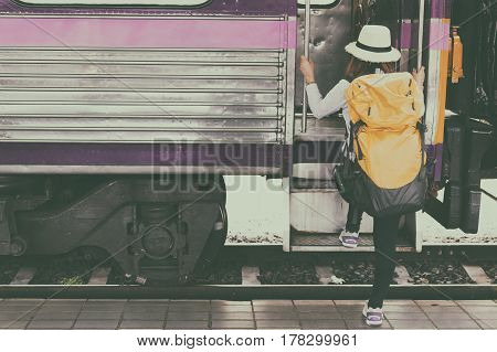 Traveler Girl With Backpack Walk Up The Train Alone. Travel Journey By Train