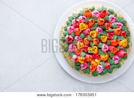Buttercream flower tulip cake beautiful festive cake decorated with colorful cream flowers for spring holidays