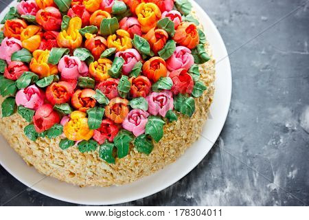 Buttercream flower tulip cake beautiful festive cake decorated with colorful cream flowers for spring holidays