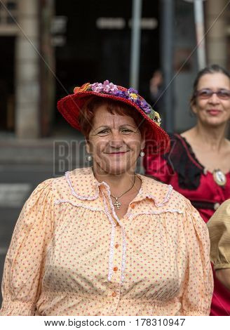 FUNCHAL MADEIRA PORTUGAL - SEPTEMBER 4 2016: Woman in historical fashion dress durnig historical and ethnographic parade of Madeira Wine Festival in Funchal. Madeira Portugal