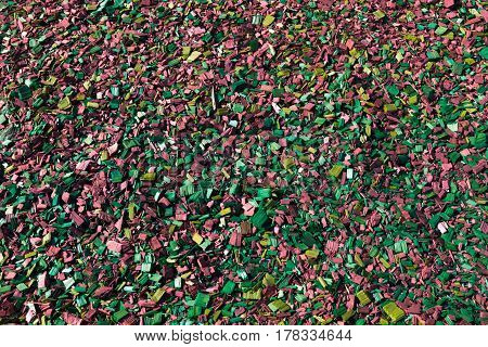 Colored wooden sawdust pieces texture close-up background