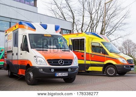 PEINE / GERMANY - MARCH 20 2017: two german ambulance vehicles stands on hospital at peine / germany