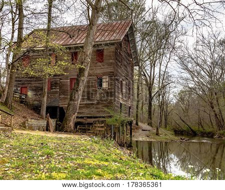Childersburg Alabama USA - March 25 2017: Springtime at the Kymulga Grist Mill on the banks of Talledega Creek which is original to Civil War period.