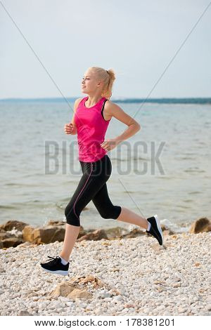 Jogging In Th Beach - Woman Runns Near Sea On Early Summer Morning