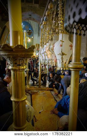 JERUSALEM ISRAEL - MARCH 25 2017: Stone of Chrismation in the Church of the Holy Sepulcher
