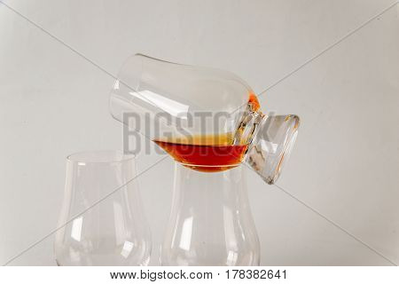 Delicious Single Malt Whiskey Glass With Another Glasses On A White Background