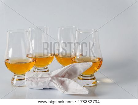 Delicious Single Malt Whiskey Glass With Bunny Napkin On A White Background