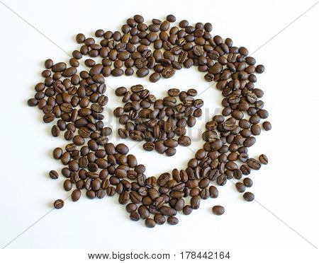 Still Life with spill grains of roasted coffee with drawing heart-shaped isolated on white background