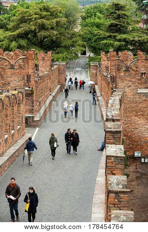 VERONA ITALY - MAY 1 2016: The Ponte Pietra (Stone Bridge) once known as the Pons Marmoreus is a Roman arch bridge crossing the Adige River in Verona Italy. The bridge was completed in 100 BC