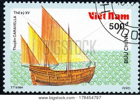 UKRAINE - CIRCA 2017: A postage stamp printed in Vietnam shows old sailing ship Caravella series Ancient boats 500d circa 1990
