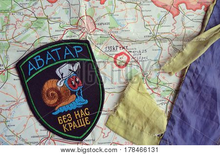 Chevron of Ukraine army.Back-Map of Ukraine  with location of Balakleya .Place of arsenal explosion at 23 march. 138 kT. of TNT power.March 23 ,2017 in Kiev, Ukraine