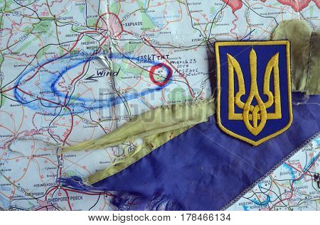 Chevron of Ukraine army.Back-Map of Ukraine  with location of Balakleya .Place of arsenal explosion at 23 march. 138 kT. of TNT power.March 23 ,2017 in Kiev, Ukraine