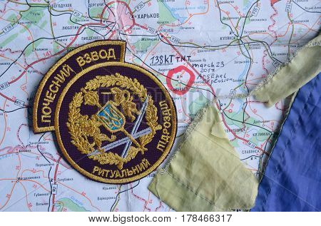 Chevron of Ukraine army.Back-Map of Ukraine  with location of Balakleya .Place of arsenal explosion at 23 march. 138 kT. of TNT power.March 23 ,2017 in Kiev, Ukraine