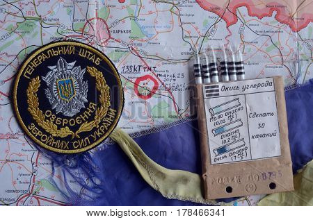 Chevron of Ukraine army.Back-Map of Ukraine  with location of Balakleya .Place of arsenal explosion at 23 march. 138 kT. of TNT power.March 23 ,2017 in Kiev, Ukraine