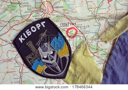 Chevron of Ukraine army.Back-Map of Ukraine  with location of Balakleya .Place of arsenal explosion at 23 march. 138 kT. of TNT power.March 23 ,2017 in Kiev, Ukraine