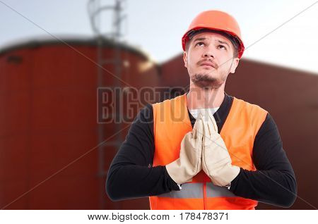 Young Worried Builder Praying For A Miracle
