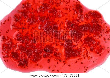 Macro shot of spilled red raspberry jam