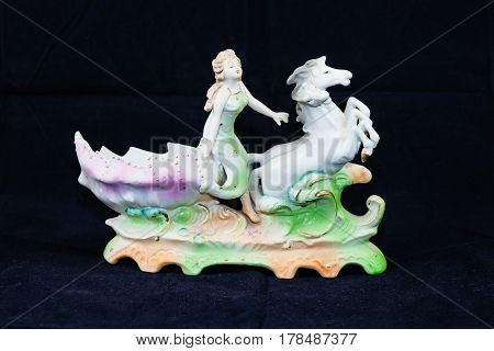 horses, woman and sea shell (four inches tall, seven wide)