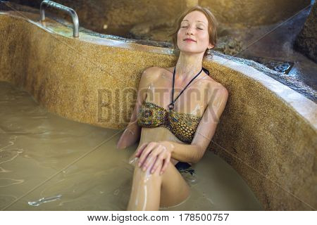Woman Lies In The Bathroom With Mud, Spa Treatments