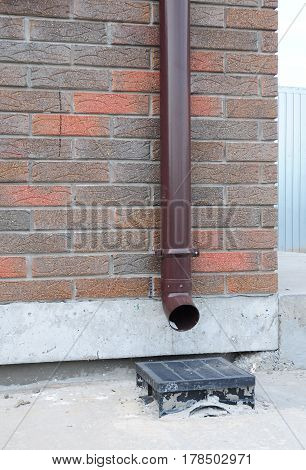 Rain gutter downspout pipeline and drain system installation. Rain Gutter Waterproofing Outdoor. Home Guttering Gutters Plastic Guttering System Repair Guttering & Drainage Pipe Exterior.